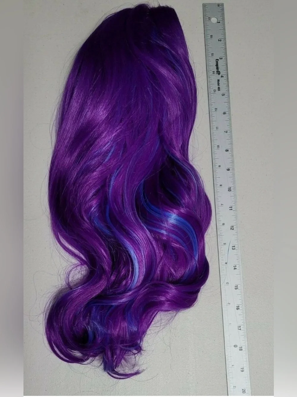 Purple synthetic long wig with blue highlights